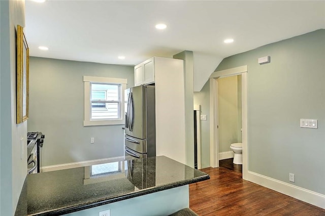 101 Knollwood Ave, Cranston, RI 02910 - kitchen with stainless steel appliances, white cabinets, dark stone countertops, recessed lighting, and dark wood-style flooring