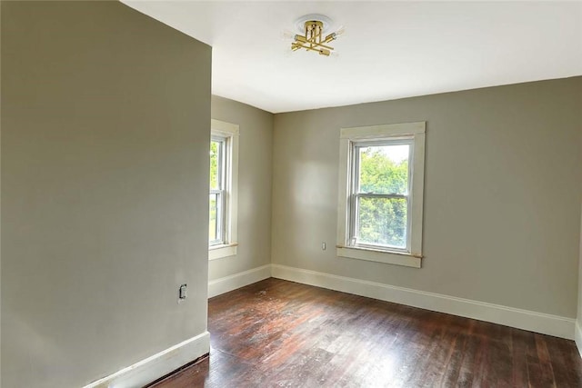 101 Knollwood Ave, Cranston, RI 02910 - empty room with plenty of natural light, baseboards, and wood finished floors