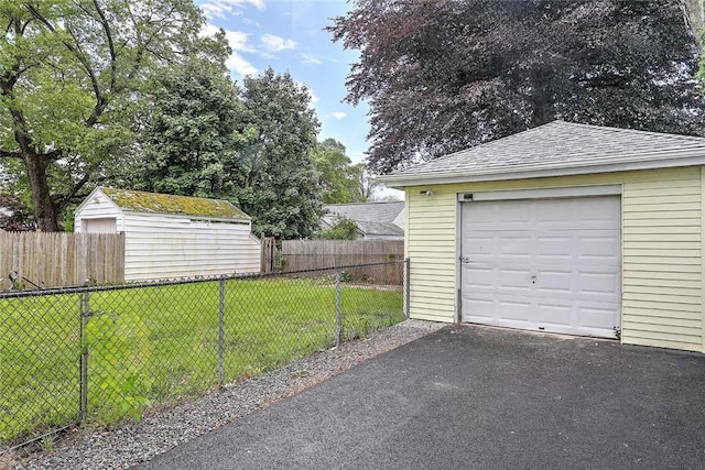 101 Knollwood Ave, Cranston, RI 02910 - detached garage featuring asphalt driveway