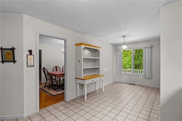84 River Farms Dr Unit 84, West Warwick, RI 02893 - dining room featuring baseboards, light tile patterned floors, and built in shelves