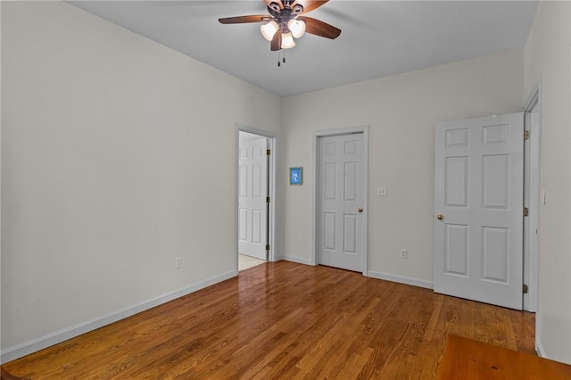 84 River Farms Dr Unit 84, West Warwick, RI 02893 - unfurnished bedroom with wood finished floors, baseboards, and a ceiling fan