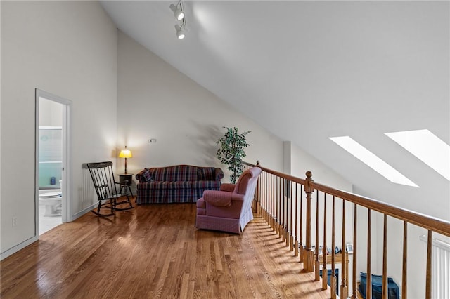 84 River Farms Dr Unit 84, West Warwick, RI 02893 - living area with vaulted ceiling, a skylight, and wood finished floors