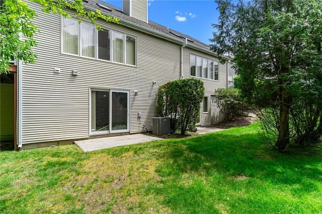84 River Farms Dr Unit 84, West Warwick, RI 02893 - back of house with a lawn, a chimney, and central AC