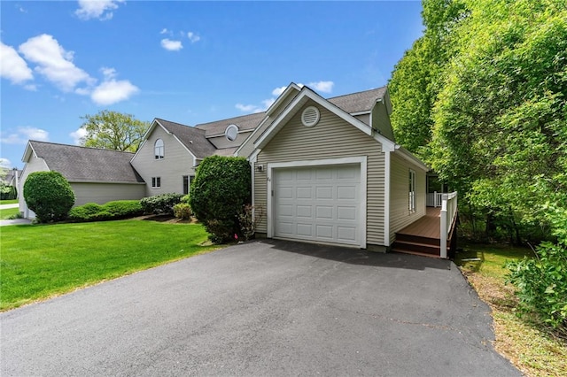 84 River Farms Dr Unit 84, West Warwick, RI 02893 - view of front of home with a garage, a front yard, driveway, and a wooden deck