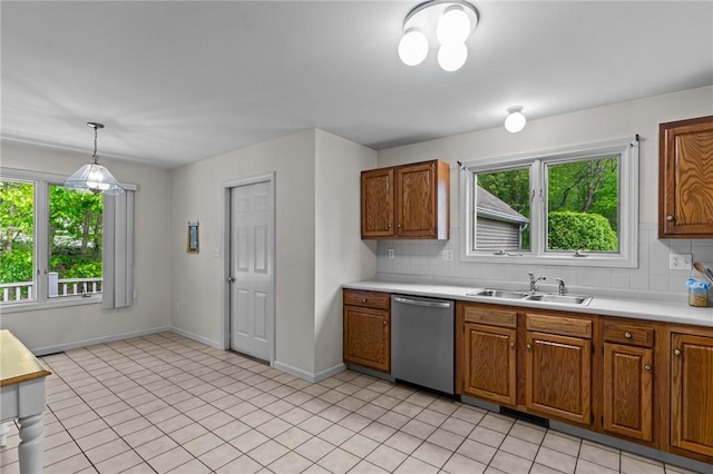84 River Farms Dr Unit 84, West Warwick, RI 02893 - kitchen featuring dishwasher, a sink, plenty of natural light, and light countertops