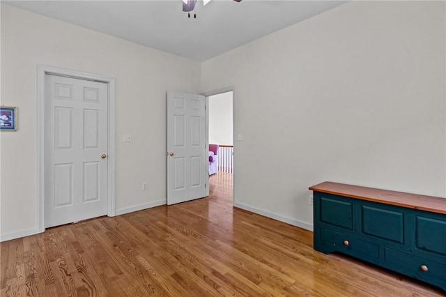 84 River Farms Dr Unit 84, West Warwick, RI 02893 - unfurnished bedroom featuring wood finished floors, baseboards, and a ceiling fan