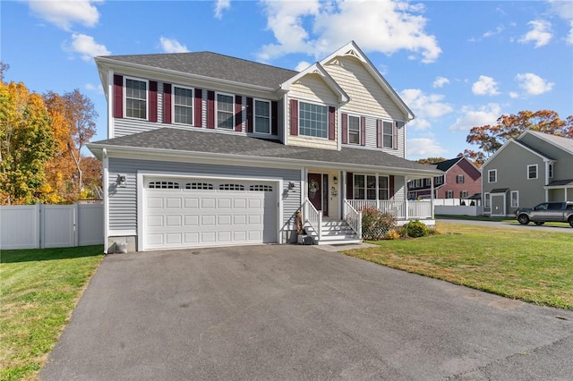 132 Theresa Marie Ave, Woonsocket, RI 02895 - view of front of property with asphalt driveway, covered porch, and an attached garage