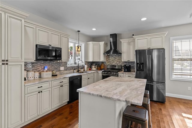 132 Theresa Marie Ave, Woonsocket, RI 02895 - kitchen featuring wall chimney exhaust hood, black appliances, a sink, tasteful backsplash, and recessed lighting