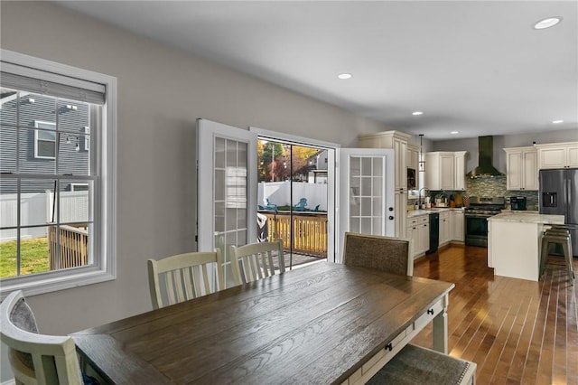 132 Theresa Marie Ave, Woonsocket, RI 02895 - dining space with recessed lighting and dark wood-style floors