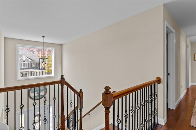 132 Theresa Marie Ave, Woonsocket, RI 02895 - stairway with hardwood / wood-style floors, baseboards, and a chandelier