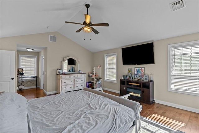 132 Theresa Marie Ave, Woonsocket, RI 02895 - bedroom featuring lofted ceiling, wood finished floors, multiple windows, and baseboards