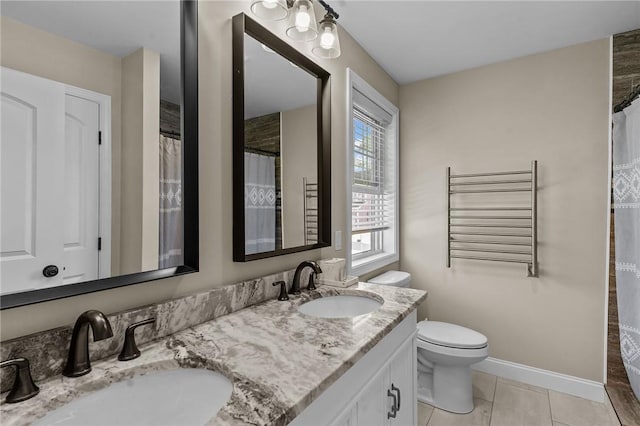 132 Theresa Marie Ave, Woonsocket, RI 02895 - full bathroom with double vanity, plenty of natural light, toilet, and radiator