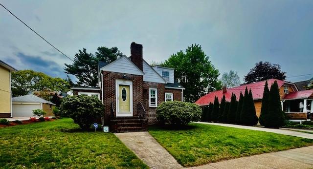 281 Auburn St, Cranston, RI 02910 - bungalow-style house with entry steps, a front yard, brick siding, and a chimney