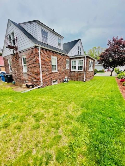 281 Auburn St, Cranston, RI 02910 - rear view of property featuring a yard and brick siding