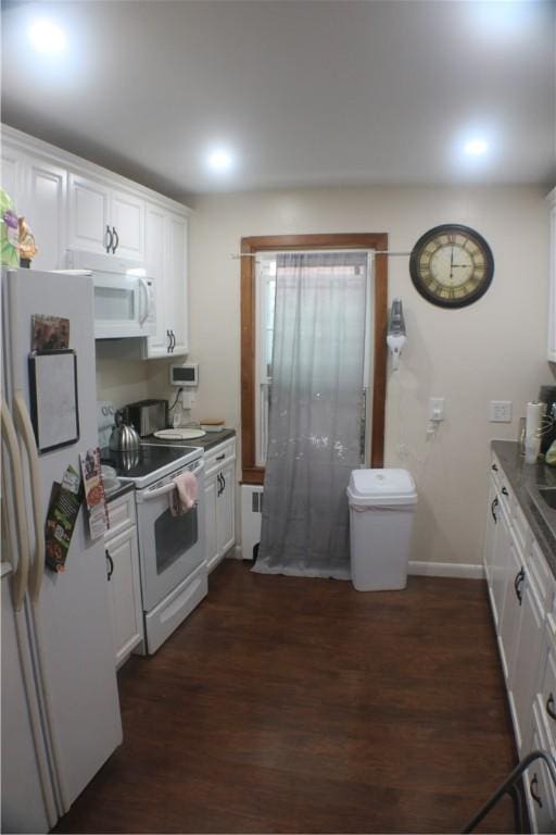 281 Auburn St, Cranston, RI 02910 - kitchen with white appliances, radiator heating unit, white cabinets, dark wood finished floors, and recessed lighting