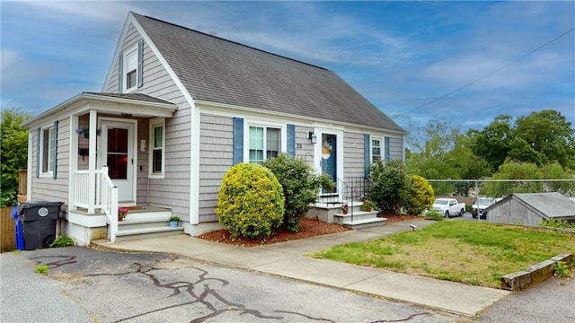 26 Urquhart St, West Warwick, RI 02893 - view of front facade featuring a shingled roof