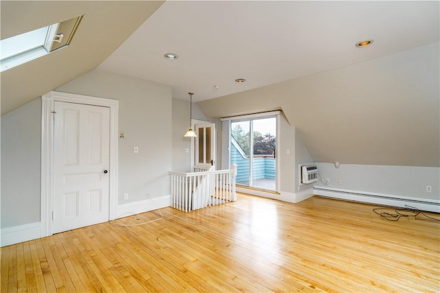 1291 Narragansett Blvd Unit 6, Cranston, RI 02905 - additional living space with lofted ceiling, light wood-style flooring, baseboard heating, a wall unit AC, and a skylight