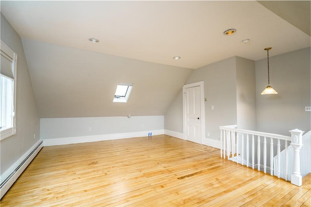 1291 Narragansett Blvd Unit 6, Cranston, RI 02905 - additional living space with a baseboard radiator, hardwood / wood-style flooring, a skylight, lofted ceiling, and recessed lighting