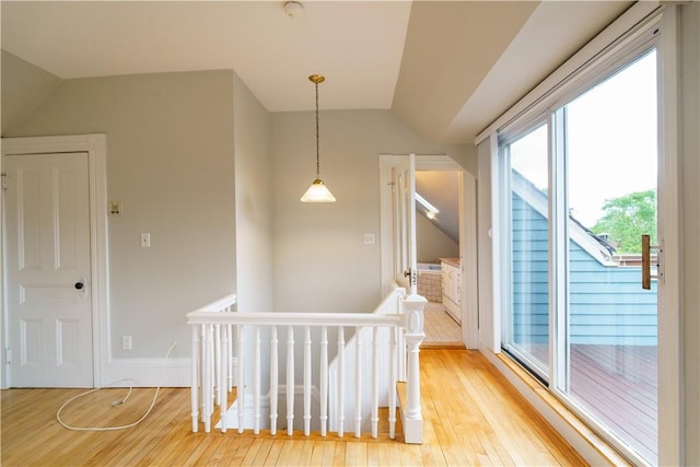 1291 Narragansett Blvd Unit 6, Cranston, RI 02905 - hallway with lofted ceiling, light wood-style floors, and an upstairs landing