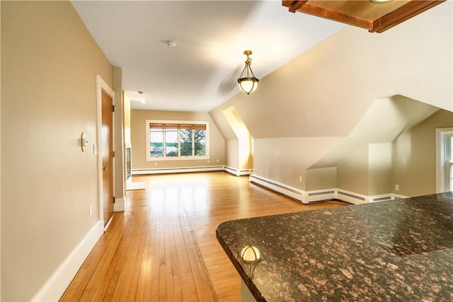 1291 Narragansett Blvd Unit 6, Cranston, RI 02905 - additional living space with a baseboard heating unit, light wood-style flooring, and baseboards