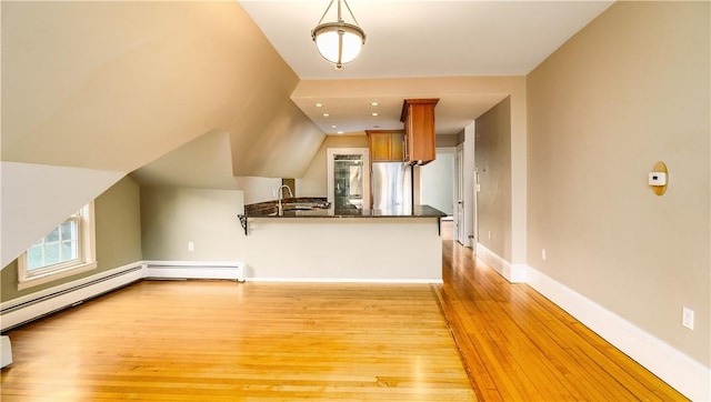 1291 Narragansett Blvd Unit 6, Cranston, RI 02905 - unfurnished living room with light wood-type flooring, a sink, and baseboards