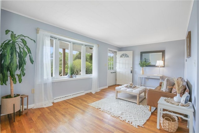 86 Weekapaug Rd, Westerly, RI 02891 - living area featuring a baseboard heating unit, wood finished floors, and baseboards