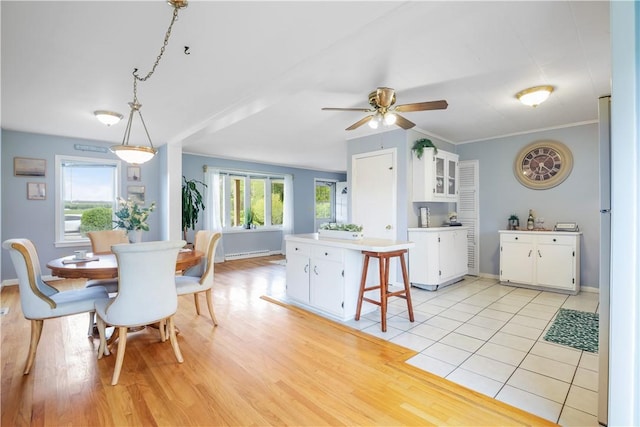 86 Weekapaug Rd, Westerly, RI 02891 - dining room with ceiling fan, light wood-style floors, baseboards, and a baseboard radiator