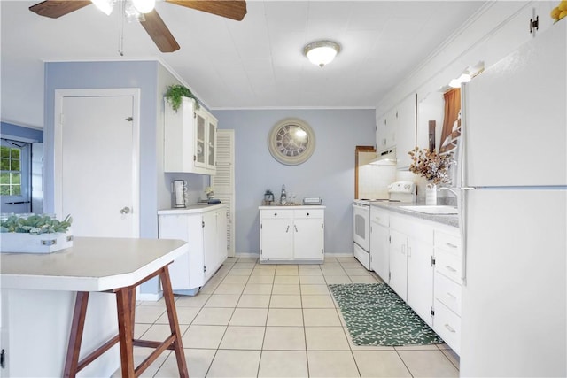 86 Weekapaug Rd, Westerly, RI 02891 - kitchen featuring white appliances, under cabinet range hood, light countertops, ceiling fan, and ornamental molding