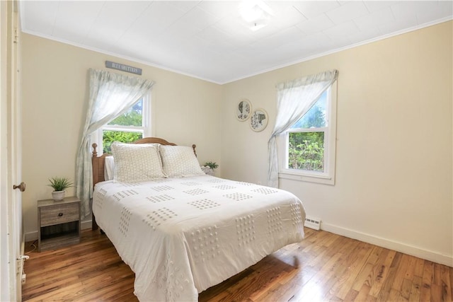 86 Weekapaug Rd, Westerly, RI 02891 - bedroom featuring crown molding, multiple windows, light wood-style floors, and baseboards
