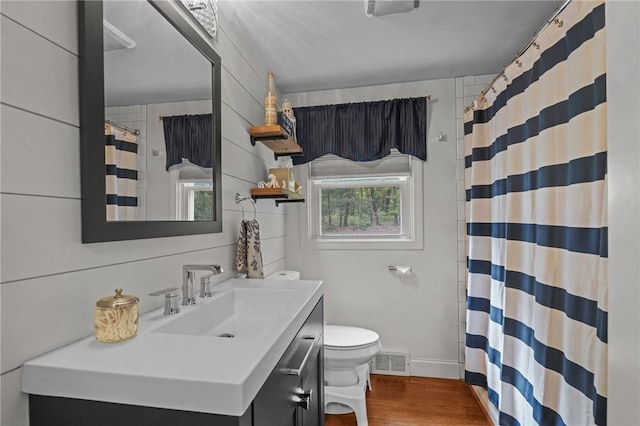 10 Bigelow Rd, Johnston, RI 02919 - bathroom with toilet, vanity, wood finished floors, a shower with curtain, and baseboards