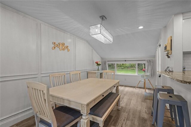 10 Bigelow Rd, Johnston, RI 02919 - dining space with vaulted ceiling, wood finished floors, and baseboards