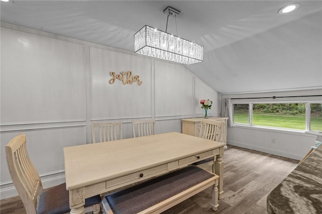 10 Bigelow Rd, Johnston, RI 02919 - dining room featuring lofted ceiling, wood finished floors, baseboards, a chandelier, and a decorative wall