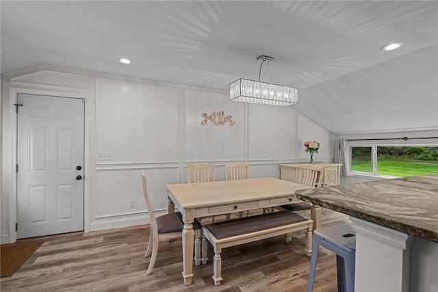 10 Bigelow Rd, Johnston, RI 02919 - dining room featuring vaulted ceiling, a decorative wall, wood finished floors, recessed lighting, and a chandelier