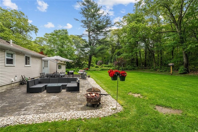 10 Bigelow Rd, Johnston, RI 02919 - view of green lawn featuring an outdoor living space with a fire pit and a patio area