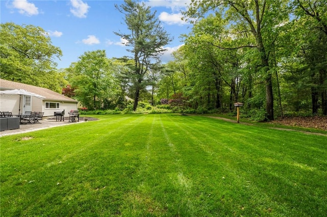 10 Bigelow Rd, Johnston, RI 02919 - view of green lawn featuring a patio