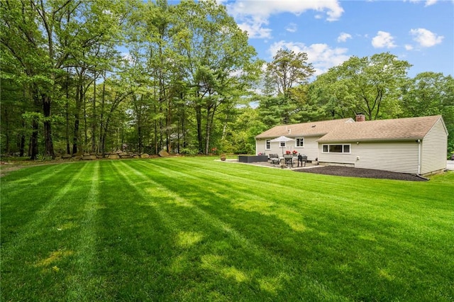 10 Bigelow Rd, Johnston, RI 02919 - view of green lawn with a patio area