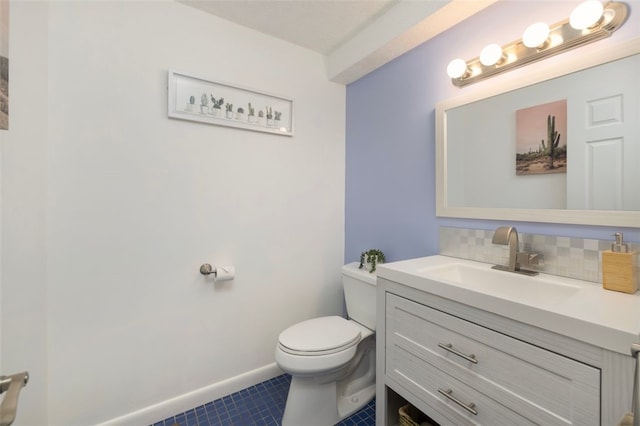 5390 Post Rd Unit 9, Warwick, RI 02818 - bathroom with vanity, backsplash, toilet, tile patterned floors, and baseboards