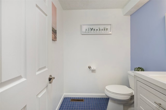 5390 Post Rd Unit 9, Warwick, RI 02818 - half bathroom with toilet, tile patterned flooring, vanity, and baseboards