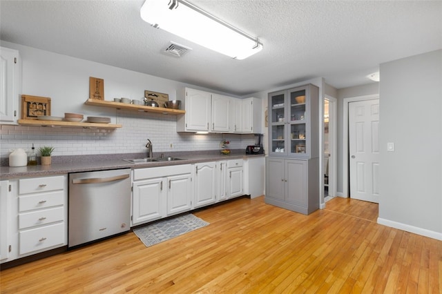 5390 Post Rd Unit 9, Warwick, RI 02818 - kitchen with dishwasher, a sink, open shelves, backsplash, and a textured ceiling