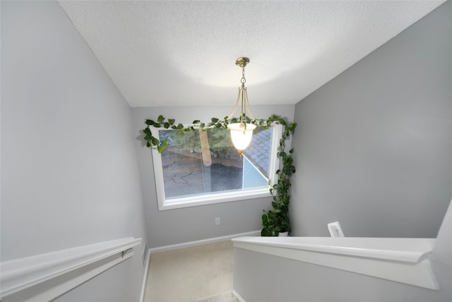 5390 Post Rd Unit 9, Warwick, RI 02818 - stairs featuring carpet floors, a textured ceiling, and baseboards