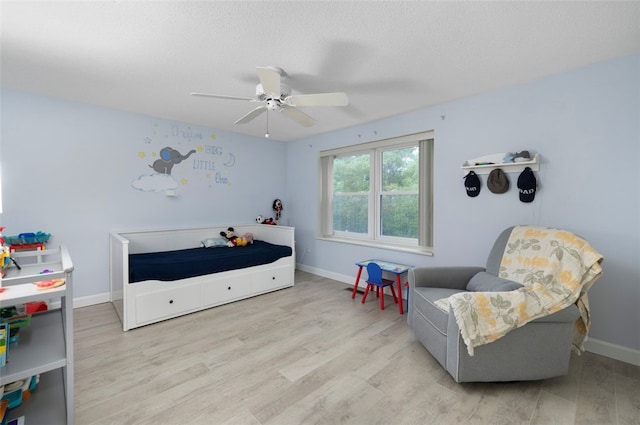 5390 Post Rd Unit 9, Warwick, RI 02818 - bedroom featuring wood finished floors, baseboards, and ceiling fan