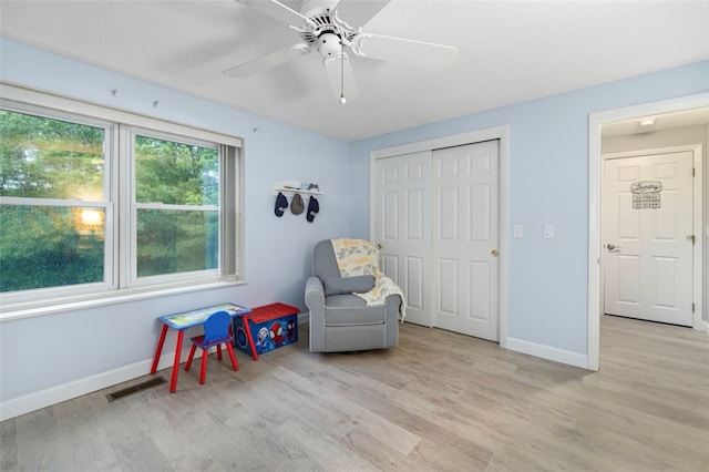 5390 Post Rd Unit 9, Warwick, RI 02818 - living area featuring light wood-style flooring, ceiling fan, and baseboards