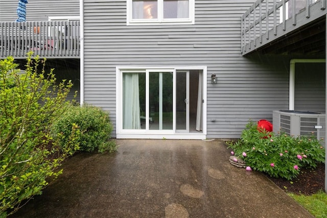 5390 Post Rd Unit 9, Warwick, RI 02818 - property entrance featuring central AC unit and a patio area