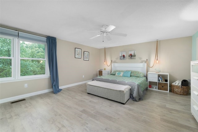 5390 Post Rd Unit 9, Warwick, RI 02818 - bedroom with wood finished floors, baseboards, and a ceiling fan