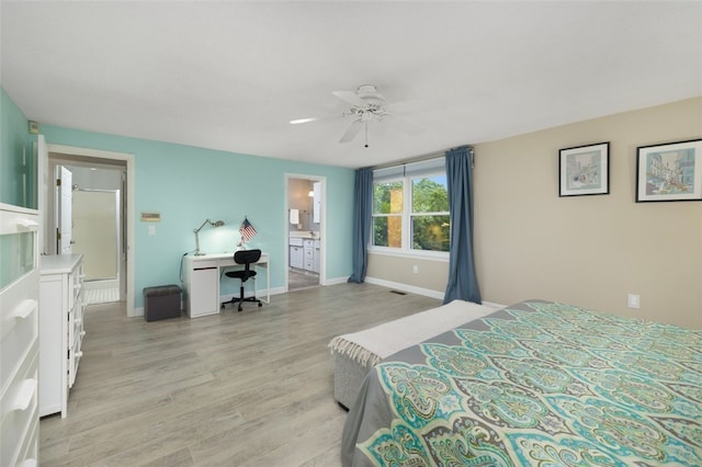 5390 Post Rd Unit 9, Warwick, RI 02818 - bedroom with light wood finished floors, a desk, baseboards, ensuite bathroom, and ceiling fan