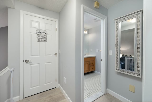 5390 Post Rd Unit 9, Warwick, RI 02818 - hallway with a textured ceiling and baseboards