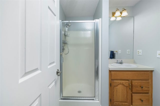 5390 Post Rd Unit 9, Warwick, RI 02818 - bathroom featuring vanity, a stall shower, and a textured ceiling