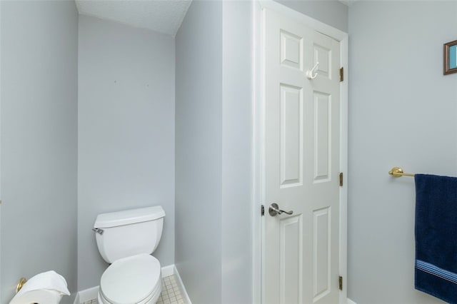5390 Post Rd Unit 9, Warwick, RI 02818 - bathroom with toilet and baseboards