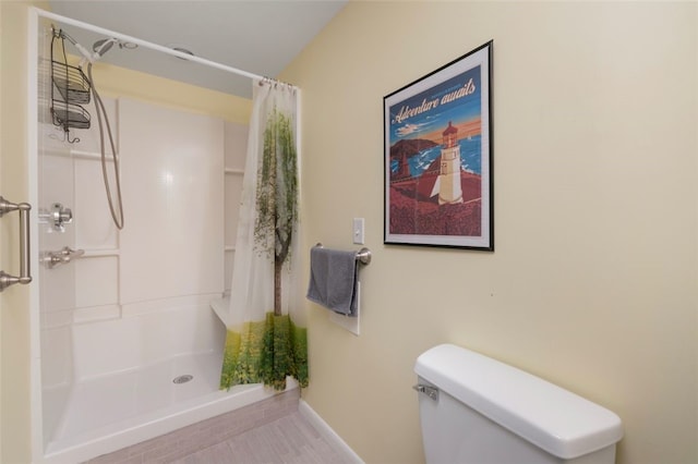 5390 Post Rd Unit 9, Warwick, RI 02818 - bathroom featuring toilet, a shower with shower curtain, and baseboards