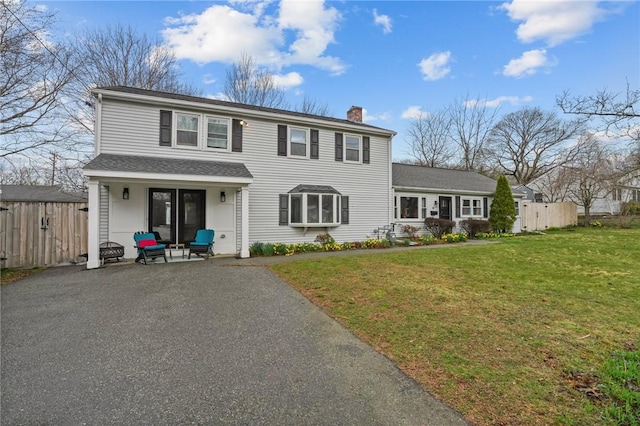 9 Rosedale Ave, Barrington, RI 02806 - traditional-style house with a chimney, asphalt driveway, and roof with shingles